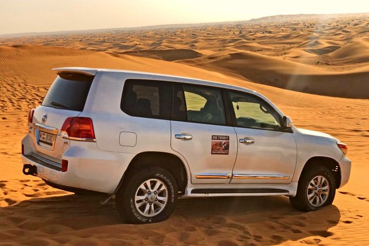 Experience the excitement of dune bashing in the iconic Lahbab desert surrounded by stunning sandy landscapes perfect for adventure and unforgettable family fun amidst traditional entertainment and delicious dining.